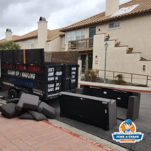 Joe's Junk and Trash Removal team clearing junk from an Orange County property