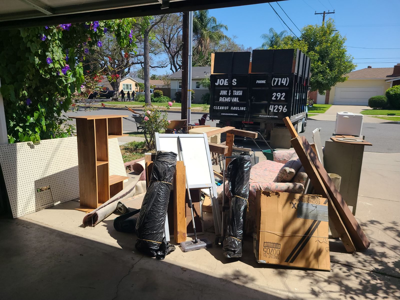 Appliance removal in Orange, CA, an old refrigerator being hauled away