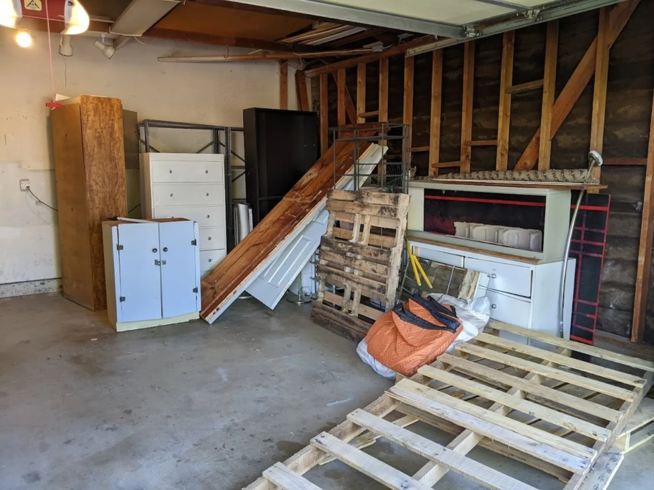 Cluttered garage before cleanout in Orange, CA
