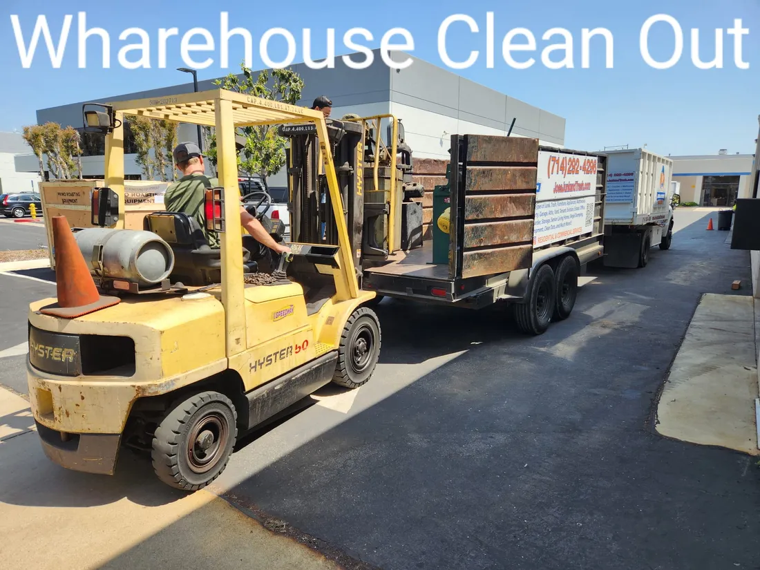 Commercial and warehouse cleanout in Orange, CA, Joe's Junk and Trash Removal loading with a forklift